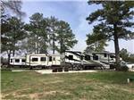 A row of trailers parked in RV sites at HIDDEN LAKE RV RESORT - thumbnail