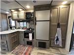 The kitchen inside a trailer at ROARING RIVER HILLS CAMPGROUND AND CABINS - thumbnail