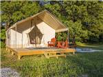 Sunshine hitting a glamping tent at ROARING RIVER HILLS CAMPGROUND AND CABINS - thumbnail
