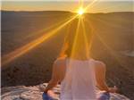 A lady meditating on top of a mountain nearby at DEANZA SPRINGS RESORT - thumbnail