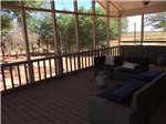 The couches on the deck with a propane heat at SHEPHERD FAMILY CABINS & RV CAMPGROUND - thumbnail