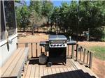 A barbecue pit on the porch at SHEPHERD FAMILY CABINS & RV CAMPGROUND - thumbnail
