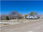 A row of empty paved RV sites at ESQUIRE ESTATES MH & RV PARK - thumbnail