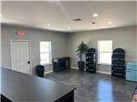 Office interior with black shelves at SAN LUIS VALLEY RV RESORT - thumbnail