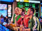Three men drinking at the bar at SPIRIT MOUNTAIN CASINO RV PARK - thumbnail