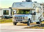 A Class C motorhome parked on-site at JESKE RV RESORT - thumbnail