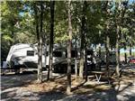 A travel trailer parked in a RV site at RUSTIC RIDGE - thumbnail