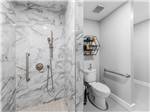 The shower stall and toilet at COWBOY CAMP UPSCALE RV PARK - thumbnail