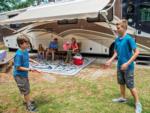 Children playing next to an RV at WILD ADVENTURES SAFARI CAMPGROUND - thumbnail