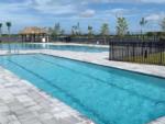 The fenced in swimming pool at ENCORE TRANQUILITY LAKES - thumbnail