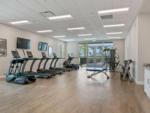 A row of treadmills in the exercise room at ENCORE TRANQUILITY LAKES - thumbnail