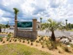 The front entrance sign at SANTA FE PALMS RV RESORT - thumbnail