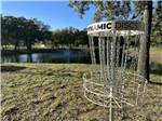 The disc golf next to the pond at STARRY NIGHT RV RESORT - thumbnail