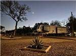 Trailers parked in sites at night at STARRY NIGHT RV RESORT - thumbnail
