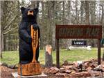 A bear statue next to the park sign at GATHERING PLACE RESORT & LODGE - thumbnail