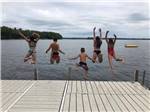 Kids jumping into the lake at GATHERING PLACE RESORT & LODGE - thumbnail