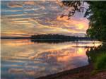 A view of the lake at sunset at GATHERING PLACE RESORT & LODGE - thumbnail