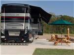A motorhome in a paved site at GATHERING PLACE RESORT & LODGE - thumbnail