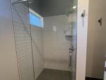 Interior of a nice tiled shower at STARRVILLE RV RESORT - thumbnail