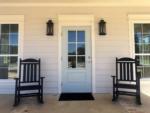 Front porch with two rocking chairs at STARRVILLE RV RESORT - thumbnail