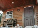 A bench on the porch of a rental cabin at PINE HAVEN VENUE & LODGING - thumbnail