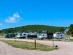 A big rig and other RVs at site at PINE HAVEN VENUE & LODGING - thumbnail