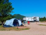 A pitched tent and RV at site at PINE HAVEN VENUE & LODGING - thumbnail