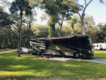 RV in site with grass lawn at Trails End RV Park - thumbnail