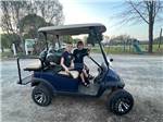Two kids sitting in a golf cart at HEAVENLY HILLS NATURE RETREAT - thumbnail