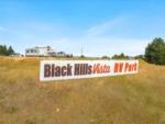 The park sign in a grassy area at BLACK HILLS VISTA RV PARK - thumbnail