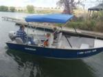 family in a small blue boat at Cascade Marina & Resort - thumbnail