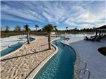 A view of of the lazy river and swimming pool at TIGER'S TRAIL RV RESORT - thumbnail