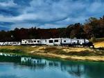 RVs by the water at Little Sinkin Creek RV Resort & UTV Campground - thumbnail