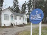 Park sign in front of cabins at Dwell Seaview - thumbnail