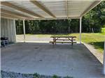 Covered seating area with picnic table - thumbnail