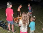 Kids roasting marshmallows at THE LANDING STRIP CAMPGROUND - thumbnail