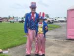 A man and a boy dressed for Fourth of July at THE LANDING STRIP CAMPGROUND - thumbnail