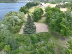 Volleyball courts among the trees - thumbnail