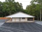 The office building and paved parking area at DEW DROP IN - thumbnail