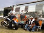Folks hanging outside their Airstream trailer - thumbnail