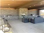 A sitting area with bbq pits at RIVERFRONT RV RESORT - thumbnail