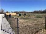 The fenced in dog area at RIVERFRONT RV RESORT - thumbnail