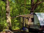 Camper with picnic table at Colinas RV Park - thumbnail