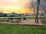 Picnic table and fire pit at Bay RV Park - thumbnail