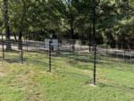 The fenced-in pet area at GONE FISHING RV RESORT - thumbnail