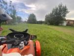 Man on ATV in field at Country Life RV Parks and Services - thumbnail