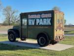An old truck with the park name on it at BEXAR COVE RV PARK - thumbnail
