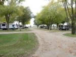 Open RV spaces next to parked trailers at Hartman Center Campground - thumbnail