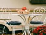 Table and two chair with a basket of gourds at Willow Beach RV Park & Marina - thumbnail