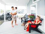 A family on the porch of a rental at OCEANS RV RESORT - thumbnail